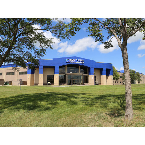 Southeast Technical College Mickelson Center exterior framed by trees