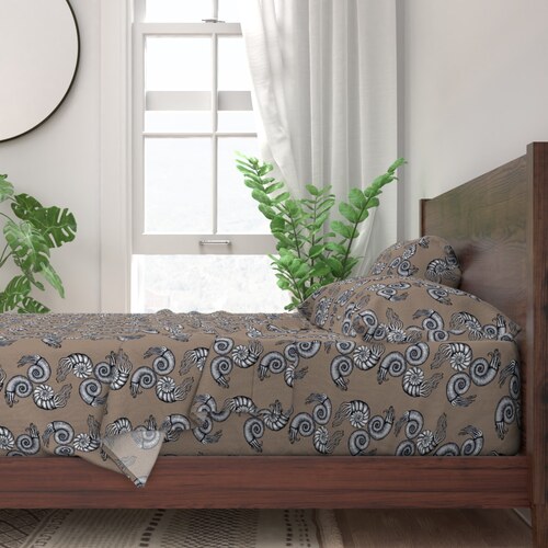 Ammonites pattern shown on a duvet and bedding