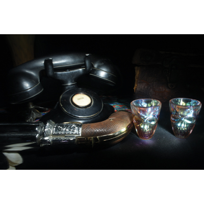 Antique phone, pistol, skull shot glasses