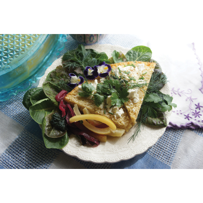 Bread, cheese, and salad elegantly plated